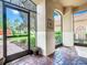 Bright and airy enclosed porch with brick flooring and views of the surrounding area at 722 Coronado Dr, Kissimmee, FL 34759