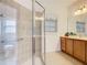 Walk-in shower with grab bars and tiled walls at 722 Coronado Dr, Kissimmee, FL 34759