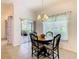 Charming dining area with a round table and view to backyard at 722 Coronado Dr, Kissimmee, FL 34759