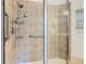 Walk-in shower with tiled walls and multiple shower heads at 722 Coronado Dr, Kissimmee, FL 34759
