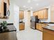 Modern kitchen with stainless steel appliances and ample counter space at 722 Coronado Dr, Kissimmee, FL 34759