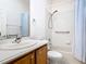 Clean bathroom with shower/tub combo and wood vanity at 722 Coronado Dr, Kissimmee, FL 34759