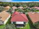 Aerial view showcasing the home's red tile roof and backyard at 722 Coronado Dr, Kissimmee, FL 34759