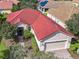 Aerial view shows the home's red tile roof and location within the community at 722 Coronado Dr, Kissimmee, FL 34759