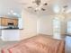 Kitchen with wood cabinets, black appliances, and a breakfast bar at 722 Coronado Dr, Kissimmee, FL 34759