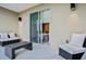 Relaxing patio with wicker furniture and sliding glass doors leading to the interior at 3213 Brasilia Ave, Kissimmee, FL 34747