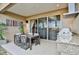 Covered patio with outdoor kitchen, dining area, and grill at 3213 Brasilia Ave, Kissimmee, FL 34747