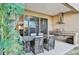 Covered patio with outdoor kitchen and dining area at 3213 Brasilia Ave, Kissimmee, FL 34747