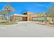 Modern community clubhouse with a covered entrance and landscaping at 3213 Brasilia Ave, Kissimmee, FL 34747