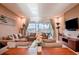 Spacious living room with access to a patio and modern decor at 3213 Brasilia Ave, Kissimmee, FL 34747