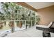 Private balcony with lounge chairs and view of trees at 3213 Brasilia Ave, Kissimmee, FL 34747