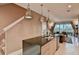 Island kitchen with dark granite and stainless steel appliances at 3213 Brasilia Ave, Kissimmee, FL 34747
