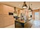 Open kitchen featuring granite countertops and modern cabinetry at 3213 Brasilia Ave, Kissimmee, FL 34747