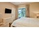 Comfortable bedroom with private balcony and stunning views at 3213 Brasilia Ave, Kissimmee, FL 34747