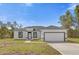 Single-story home with attached garage at 2396 Sw 147Th Lane Rd, Ocala, FL 34473