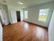 Bright bedroom with wood-look flooring, double closets and large windows at 1204 Vero Beach Way, Poinciana, FL 34759
