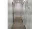 Bright hallway with tile flooring, built-in storage, and exterior door at 1204 Vero Beach Way, Poinciana, FL 34759
