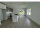 Modern kitchen with island, stainless steel appliances, and tile flooring at 1204 Vero Beach Way, Poinciana, FL 34759