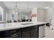 Modern kitchen with white quartz countertops and dark cabinetry at 2917 Windmill Dr, Kissimmee, FL 34741