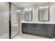 Elegant bathroom with double sinks and a large walk-in shower at 2917 Windmill Dr, Kissimmee, FL 34741
