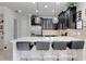Modern kitchen with dark cabinetry, white countertops, and stainless steel appliances at 2917 Windmill Dr, Kissimmee, FL 34741