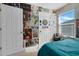 Stylish bedroom with a full-size bed and a wall covered in posters at 2917 Windmill Dr, Kissimmee, FL 34741