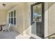 Inviting front porch with small table and chairs at 2917 Windmill Dr, Kissimmee, FL 34741