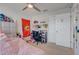 Cozy bedroom with a queen-size bed and built-in desk area at 2917 Windmill Dr, Kissimmee, FL 34741