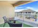 Private balcony with small table and chairs, artificial turf at 2917 Windmill Dr, Kissimmee, FL 34741