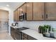 Kitchen with stainless steel appliances and light brown cabinets at 2108 Riley Ave, Eagle Lake, FL 33839