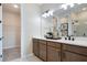 Double vanity bathroom with a walk-in shower and ample storage at 2108 Riley Ave, Eagle Lake, FL 33839