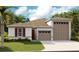 Two-car garage and a welcoming front porch at 2108 Riley Ave, Eagle Lake, FL 33839