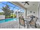 Screened pool and patio area with outdoor grill and table at 274 Captiva Dr, Davenport, FL 33896
