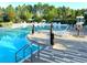Expansive pool with plenty of lounge chairs and umbrellas at 274 Captiva Dr, Davenport, FL 33896