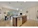 Open kitchen with island, stainless steel appliances, and view to living room at 274 Captiva Dr, Davenport, FL 33896