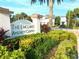 The Enclaves Amenity Center entrance with landscaping at 274 Captiva Dr, Davenport, FL 33896