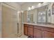 Modern bathroom with double vanity and walk-in shower at 274 Captiva Dr, Davenport, FL 33896