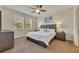 Comfortable bedroom with king-size bed and ceiling fan at 274 Captiva Dr, Davenport, FL 33896