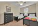 Guest bedroom with twin beds, a dresser, and ceiling fan at 274 Captiva Dr, Davenport, FL 33896