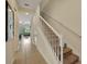 Elegant staircase with white railing and carpeted steps at 274 Captiva Dr, Davenport, FL 33896