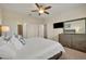 King-size bed, dresser, and view of another room at 274 Captiva Dr, Davenport, FL 33896