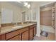Bathroom with double vanity and bathtub at 274 Captiva Dr, Davenport, FL 33896