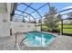 Inviting screened pool with paver deck and lush landscaping at 274 Captiva Dr, Davenport, FL 33896