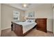 Bright bedroom with a wooden sleigh bed, dresser, and window coverings at 274 Captiva Dr, Davenport, FL 33896