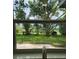 View of a backyard with green grass and trees at 5819 Colchester Dr, Orlando, FL 32812