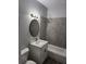Updated bathroom with gray tile and modern vanity at 5819 Colchester Dr, Orlando, FL 32812