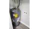 New Rheem water heater in a laundry closet at 5819 Colchester Dr, Orlando, FL 32812