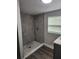 Large walk-in shower with gray tile at 5819 Colchester Dr, Orlando, FL 32812