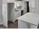 Modern kitchen featuring white cabinets and quartz countertops at 5819 Colchester Dr, Orlando, FL 32812