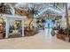 Bright and airy lobby with tropical plants and unique light fixtures at 3037 Sea Plane Ln, Kissimmee, FL 34747